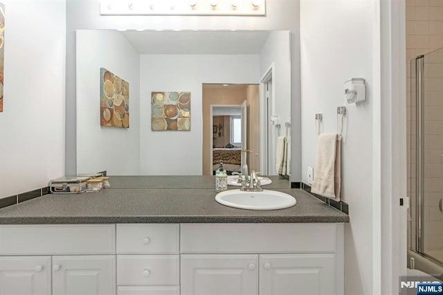 2150 Center Ave Unit 19A, Fort Lee, NJ 07024 - ensuite bathroom featuring a shower with door and vanity