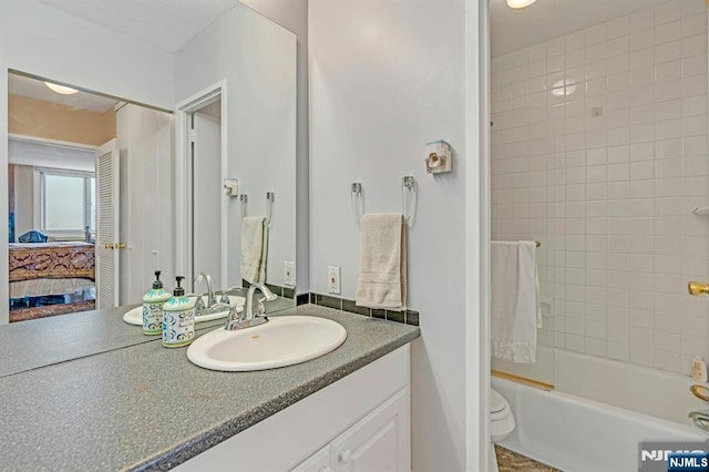 2150 Center Ave Unit 19A, Fort Lee, NJ 07024 - ensuite bathroom featuring vanity, toilet, and shower / tub combination