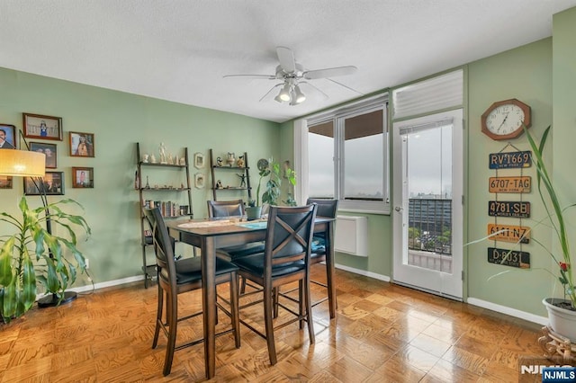 2150 Center Ave Unit 19A, Fort Lee, NJ 07024 - dining area featuring a ceiling fan, baseboards, and a textured ceiling