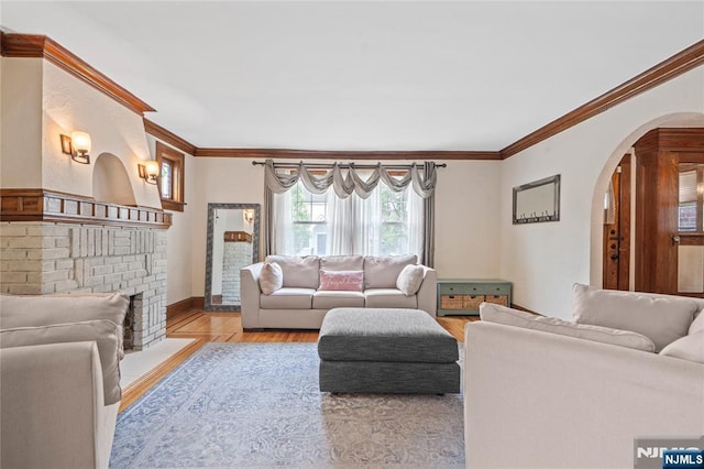 126 Beech St, Nutley, NJ 07110 - living area with ornamental molding, arched walkways, wood finished floors, and baseboards