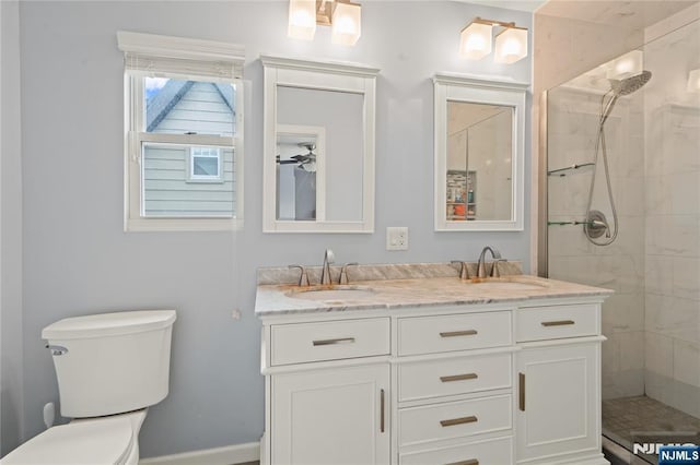 126 Beech St, Nutley, NJ 07110 - full bathroom with double vanity, toilet, and tiled shower