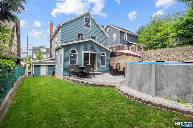 126 Beech St, Nutley, NJ 07110 - back of house with a patio and a chimney