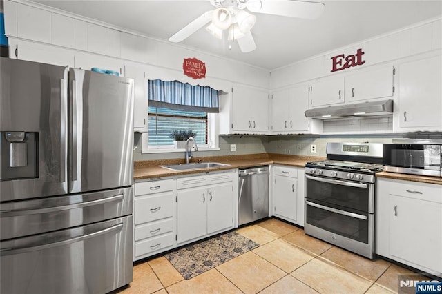 126 Beech St, Nutley, NJ 07110 - kitchen with appliances with stainless steel finishes, a sink, ceiling fan, and light tile patterned floors