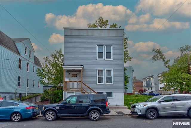 229 21st St, Irvington, NJ 07111 - view of front facade with fence