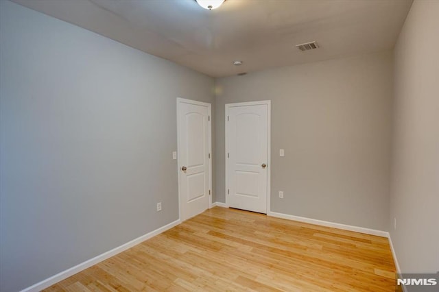 229 21st St, Irvington, NJ 07111 - spare room featuring visible vents, baseboards, and light wood-type flooring
