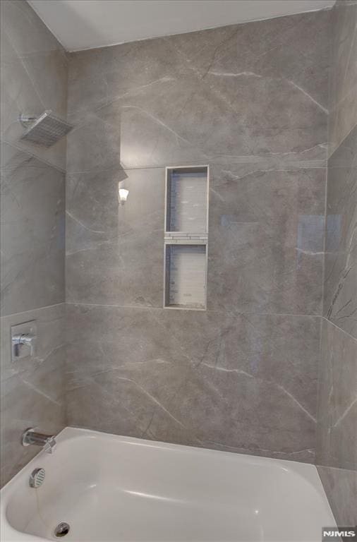 229 21st St, Irvington, NJ 07111 - bathroom featuring tub / shower combination