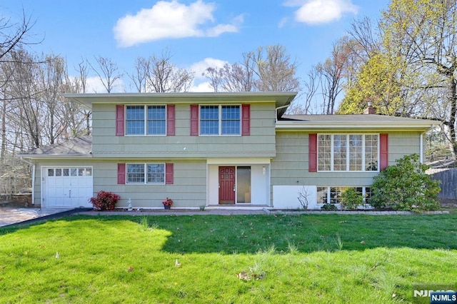 31 Chelsea Ct, Hillsdale, NJ 07642 - tri-level home with driveway, a front lawn, a garage, and a chimney