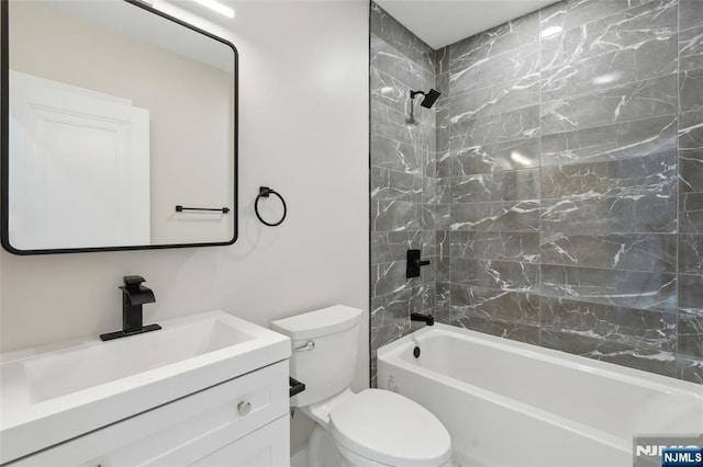 full bath featuring shower / bathtub combination, vanity, and toilet