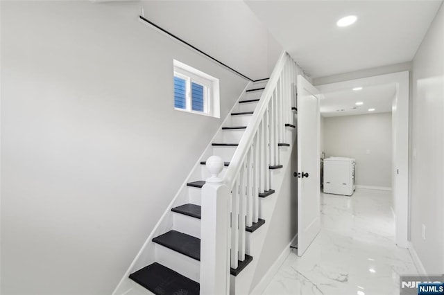 staircase featuring marble finish floor, baseboards, and recessed lighting