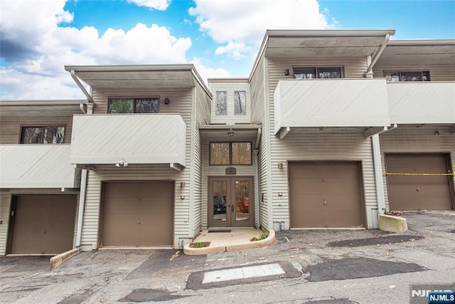 79 Adams Ter Unit 79, Clifton, NJ 07013 - multi unit property featuring a garage, a balcony, french doors, and driveway