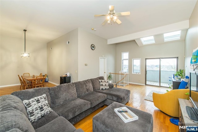 79 Adams Ter Unit 79, Clifton, NJ 07013 - living room with light wood-type flooring, baseboards, a ceiling fan, and a skylight
