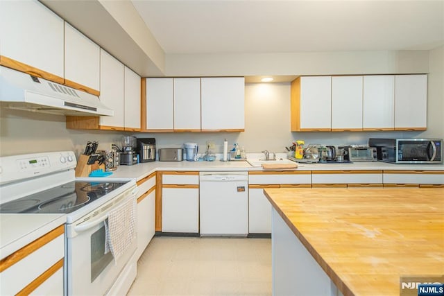 79 Adams Ter Unit 79, Clifton, NJ 07013 - kitchen featuring butcher block countertops, under cabinet range hood, white appliances, and white cabinets
