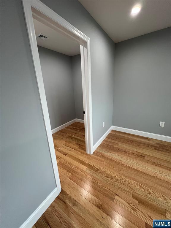 79 Van Winkle Ave, Hawthorne, NJ 07506 - empty room with wood finished floors and baseboards