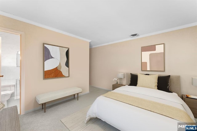 carpeted bedroom featuring baseboards, crown molding, ensuite bathroom, and visible vents