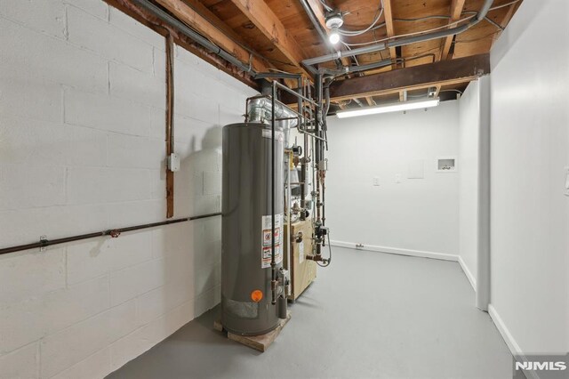 utility room featuring gas water heater