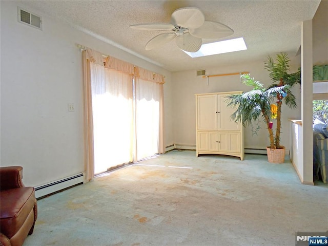 112 Heatherington Ct, Lacey, NJ 08734 - interior space featuring baseboard heating, light carpet, visible vents, and a skylight