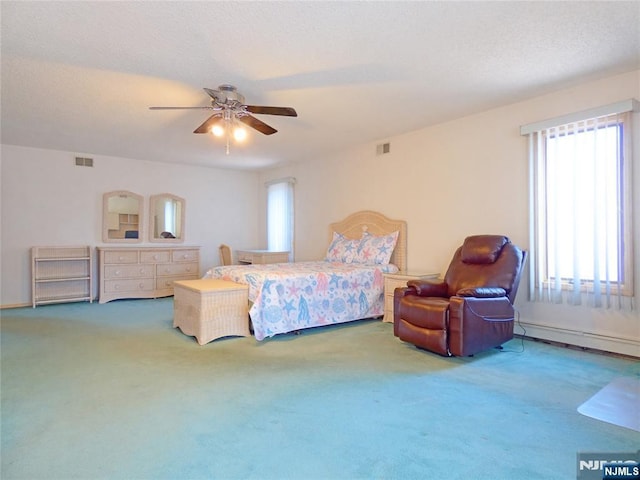 112 Heatherington Ct, Lacey, NJ 08734 - bedroom with carpet floors, ceiling fan, visible vents, and baseboard heating