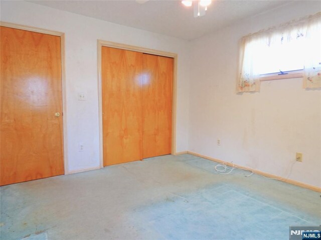 112 Heatherington Ct, Lacey, NJ 08734 - unfurnished bedroom featuring a closet, baseboards, a ceiling fan, and carpet floors