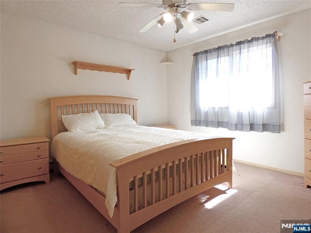 112 Heatherington Ct, Lacey, NJ 08734 - carpeted bedroom with visible vents, ceiling fan, baseboards, and a textured ceiling