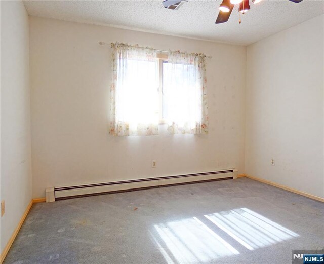 112 Heatherington Ct, Lacey, NJ 08734 - carpeted empty room with a textured ceiling, a baseboard heating unit, and a ceiling fan