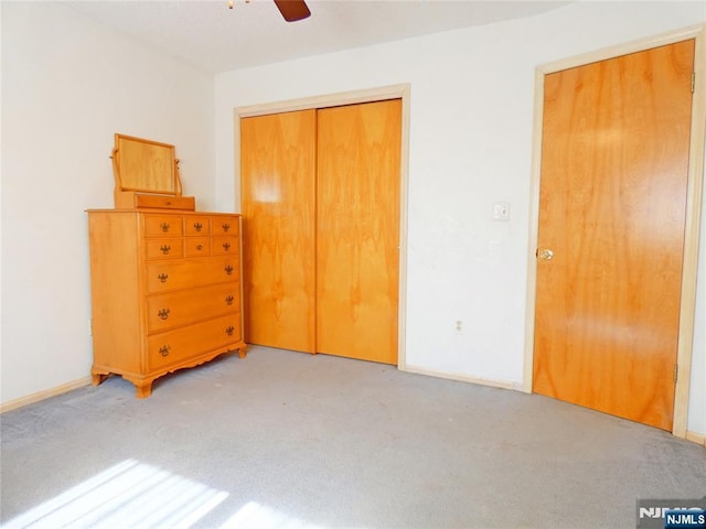 112 Heatherington Ct, Lacey, NJ 08734 - unfurnished bedroom with a closet, baseboards, carpet flooring, and ceiling fan