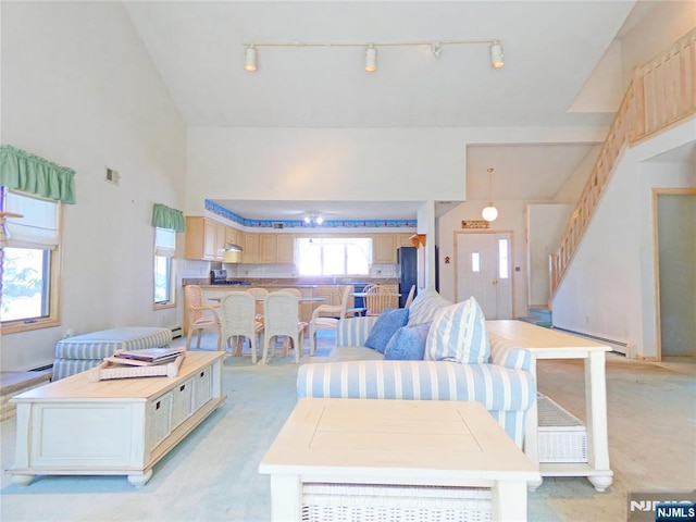 112 Heatherington Ct, Lacey, NJ 08734 - living room with rail lighting, baseboard heating, light colored carpet, and visible vents