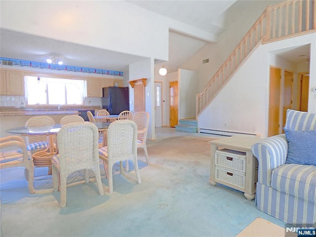 112 Heatherington Ct, Lacey, NJ 08734 - dining space with stairway, baseboard heating, light colored carpet, and a towering ceiling