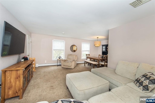 carpeted living room with baseboards, visible vents, a baseboard heating unit, and baseboard heating