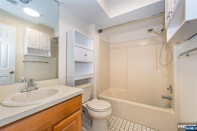 full bathroom featuring vanity, toilet, tile patterned flooring, and  shower combination