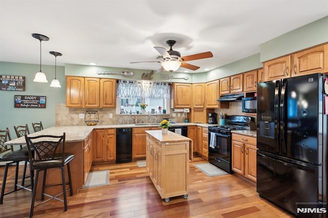 2 Beechwood Ave, Par-Troy Hills Twp, NJ 07034 - kitchen featuring black appliances, a peninsula, under cabinet range hood, light wood finished floors, and a ceiling fan