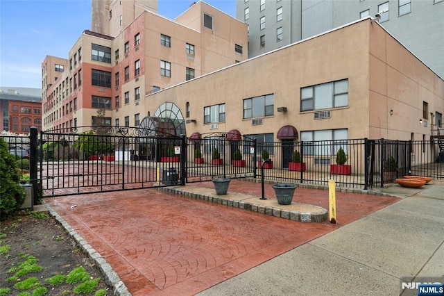 view of building exterior with fence