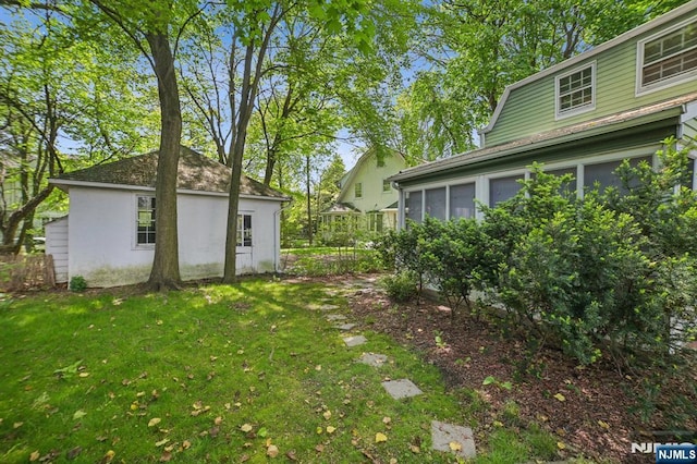 view of yard with a sunroom