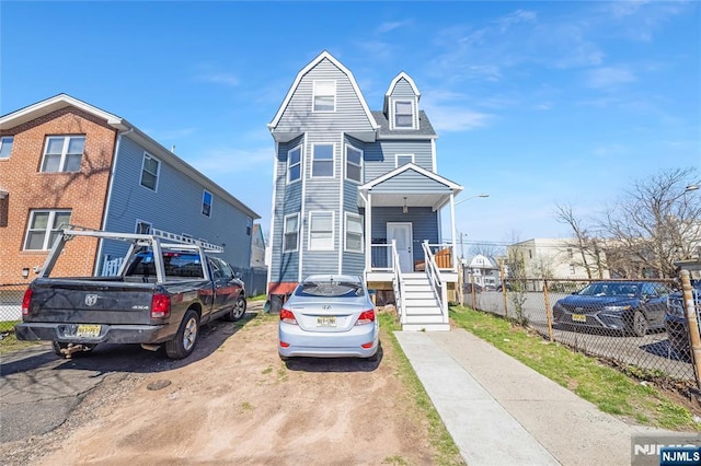 view of front of house with fence