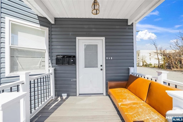 entrance to property featuring a balcony