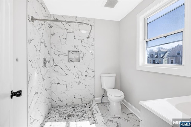 full bath with marble finish floor, baseboards, toilet, and a marble finish shower