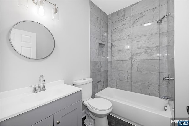 bathroom with toilet, vanity, and shower / bath combination