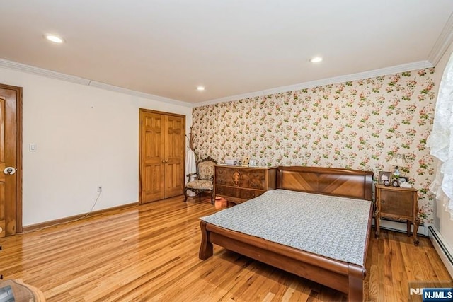 bedroom with ornamental molding, baseboards, light wood finished floors, and wallpapered walls