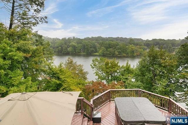 water view featuring a wooded view
