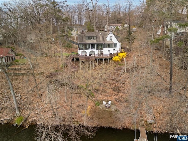 birds eye view of property featuring a water view