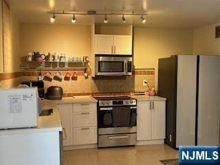 770ANDERS Anderson Ave Unit 4A, Cliffside Park, NJ 07010 - kitchen with white cabinets, rail lighting, light countertops, and appliances with stainless steel finishes