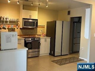 770ANDERS Anderson Ave Unit 4A, Cliffside Park, NJ 07010 - kitchen featuring rail lighting, light countertops, white cabinets, visible vents, and stainless steel appliances