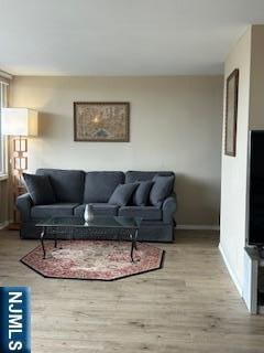 770ANDERS Anderson Ave Unit 4A, Cliffside Park, NJ 07010 - living area with baseboards and wood finished floors