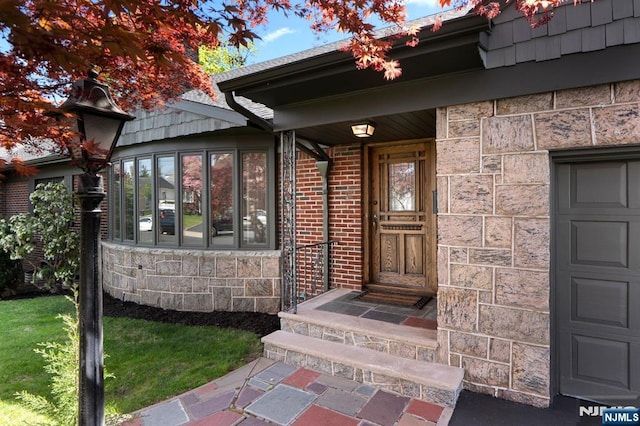 property entrance with brick siding