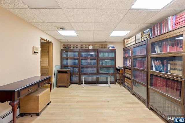 storage room featuring a baseboard radiator and visible vents