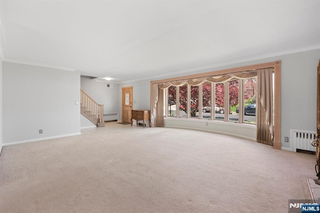 unfurnished living room with radiator and crown molding