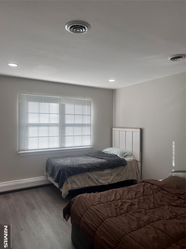 1371 Van Houten Ave Unit 1, Clifton, NJ 07013 - bedroom featuring wood finished floors, a baseboard heating unit, visible vents, and recessed lighting