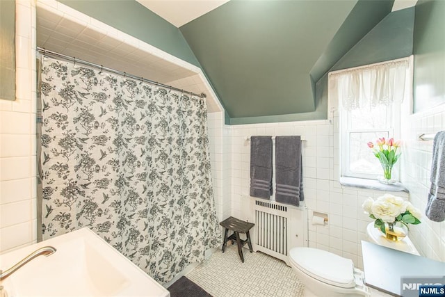 full bathroom with a shower with shower curtain, radiator heating unit, tile patterned flooring, and tile walls