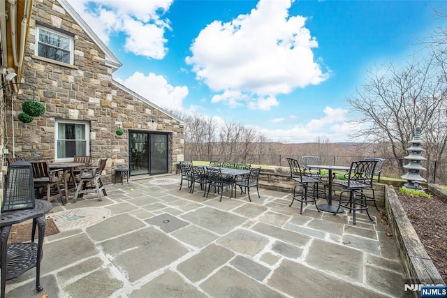 view of patio featuring outdoor dining area