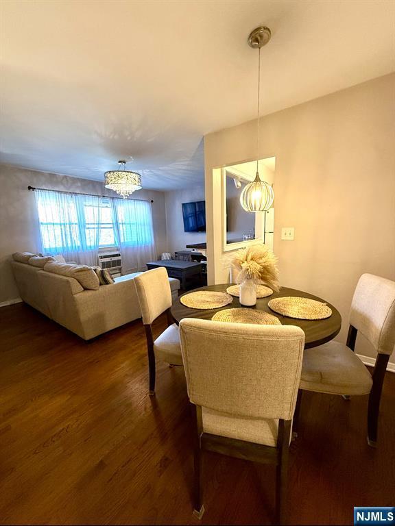 25 River Unit B10, Nutley, NJ 07110 - dining room with dark wood-type flooring and a chandelier