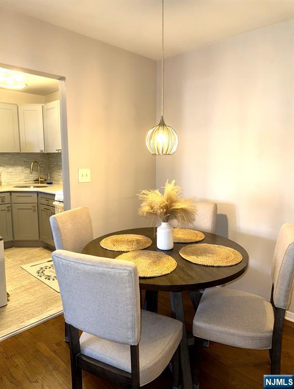 25 River Unit B10, Nutley, NJ 07110 - dining area featuring light wood-style flooring
